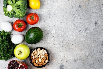 Food Nutrition Concept. Vegetables, fruits and bean product on light stone table background. Top view, flat lay, copy space
