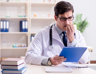 Young doctor sitting in the office