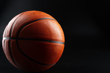 Basketball ball close up on dark black background. Basketball concept