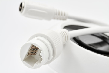 Cables for connection of dome secure camera are on the surveillance camera. Closeup, selective focus © marketlan