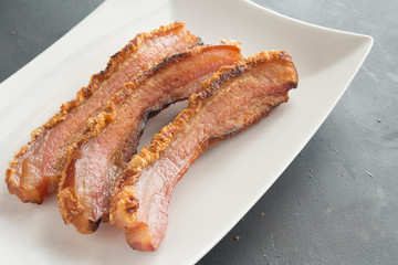 slice of bacon on plate