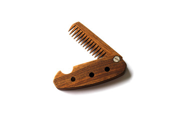 Male wooden comb for beard and hair isolated on a white background.