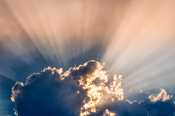 Sunset / sunrise with clouds, Rays of light shining through clouds, sunset.