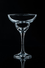 Wine glass on black background, front view