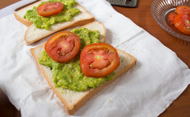 Avocado toast with fresh tomatoes slice