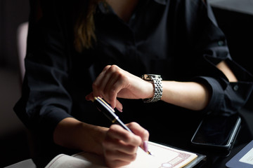 Closeup view of women's wrist watch on the girl's hand.
