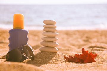 Balanced stone pyramid on sand on beach. Zen rock, concept of balance and harmony