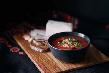 Traditional ukrainian cuisine. Bowl with tasty red borscht soup.