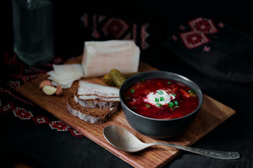 Traditional ukrainian cuisine. Bowl with tasty red borscht soup.