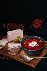 Traditional ukrainian cuisine. Bowl with tasty red borscht soup.
