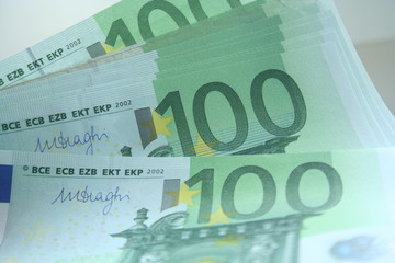 Fototapeta premium Euro currency, offers 100 euro bank note on table