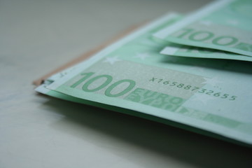 Group of 100 euro notes. Euro banknotes close up. Several hundred euro banknotes Many of one hundred euro banknotes lie side by side.