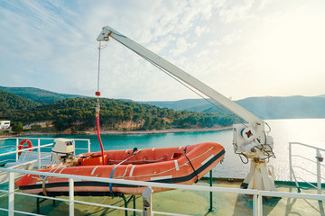 Transportation and safety. Lifeboat on ferry deck.
