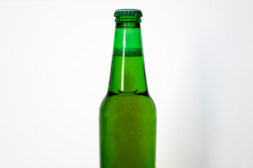 Green bottle of beer on a white background.