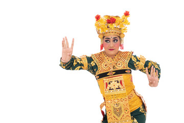 Young women wearing traditional dance clothes are performing movements dancing Balinese