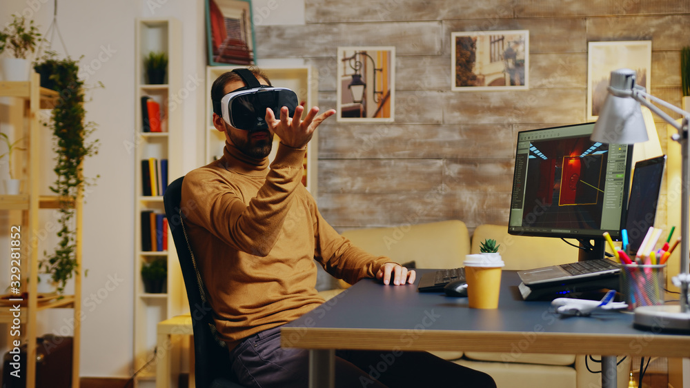 Poster game developer with virtual reality headset