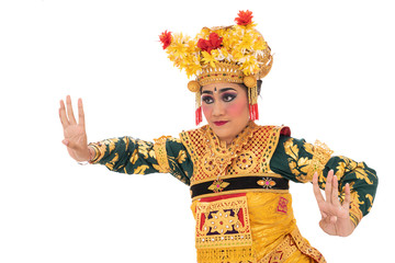 Women in make up and wear traditional dance clothes when dancing Balinese