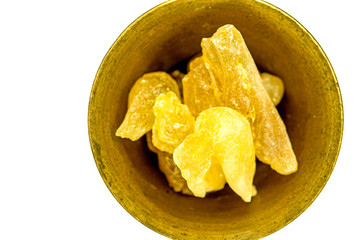 Olibanum in a mortar, cut out on a white background