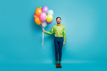 Fototapeta na wymiar Full length body size view of nice attractive funky cheerful cheery guy holding in hands air balls festal day wedding isolated on bright vivid shine vibrant blue green teal turquoise color background