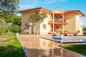 Fototapeta premium Classic new home with pool. Real estate Luxury exterior design pool villa