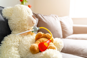 Teddy bear doctor with medicine toys. Pediatric concept