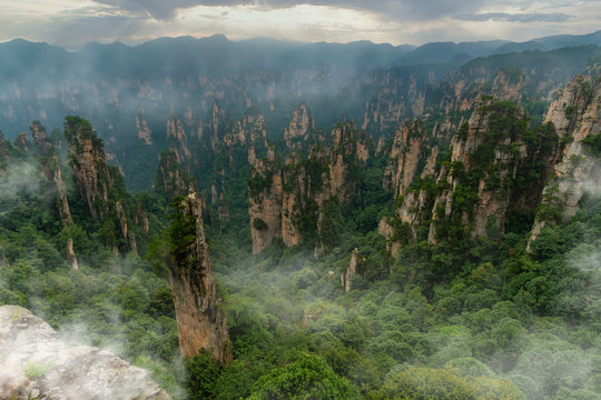 Foggy panorama of mountain range in Yellow Stone Stronghold (Huangshi Zhai) in Yuanjiajie Scenic Area , Zhangjiajie National Park, China