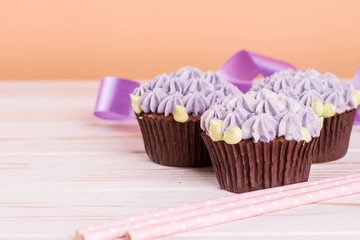 Chocolate cupcakes on a wooden table with salted caramel inside.