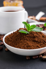 Mushroom Chaga Coffee Superfood Trend-dry and fresh mushrooms and coffee beans on dark background with mint.