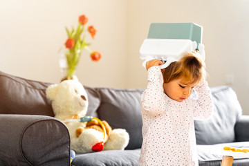 Bad behaviour toddler girl playing strange game