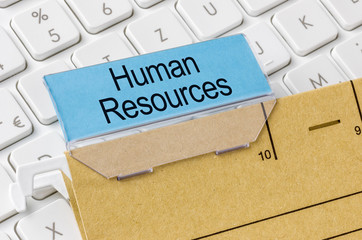 A brown file folder labeled with Human Resources