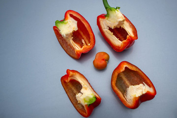 Red juicy bell pepper cut into four parts