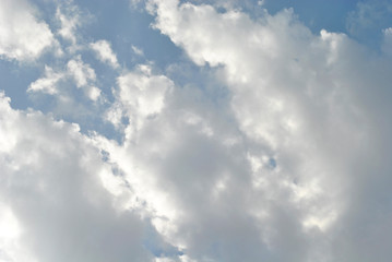 Naklejka na ściany i meble Cloudy nice sky at midday with sun bright