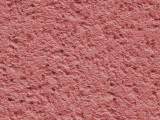 Red background facade plaster . Monolithic plaster decorative backdrop. Single layer scraped cement plaster wallpaper. Exterior building structure backdrop. Silica sand cement wall plaster