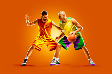 Fototapeta na wymiar colourful professional basketball players isolated over orange background