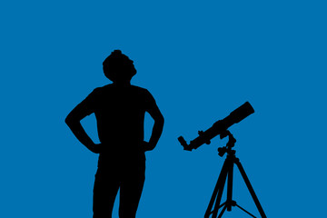 Amateur astronomer looking at the stars with a telescope. Astronomy and astrology concept. Studio...