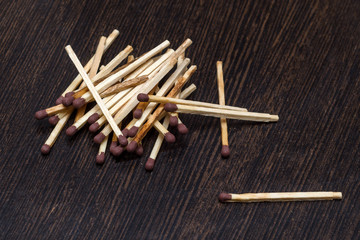 pile of matches on wooden background