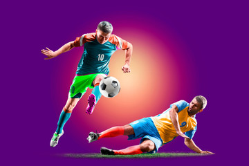 colourful professional soccer players isolated over purple background