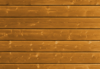 Brown wooden background with detailed wood structure with knots and nail holes. Dark wood texture...