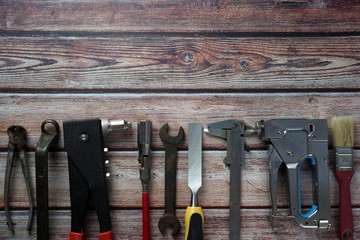 Different tools on a wooden background