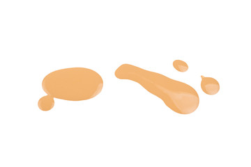 Liquid foundation swatch isolated on white background. Close Up of makeup cream sample.
