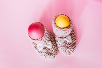 two easter eggs in slippers