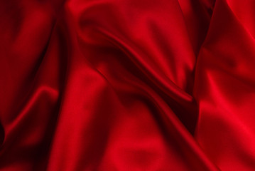 Red silk or satin luxury fabric texture can use as abstract background.