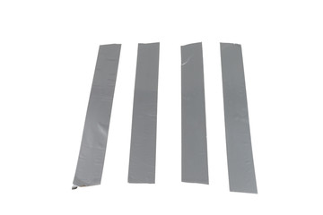 Silver scotch tape pieces isolated on white background.