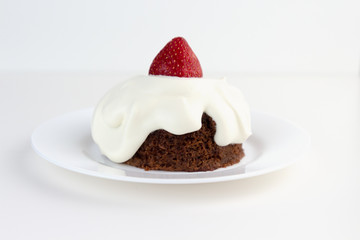Ketogenic chocolate almond cake with whipped cream and strawberry. Low-Carb, Sugar-Free.