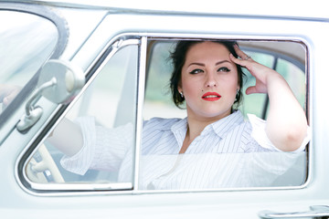 Girl in a retro car