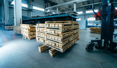 Wooden pallets on sandwich panel manufacturing