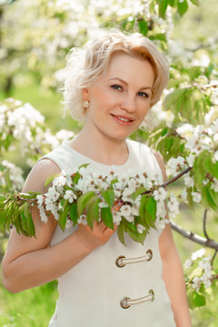 portrait girl with branch of flowering tree