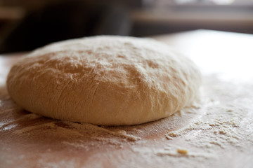 Fototapeta na wymiar Fresh ball of homemade yeast dough for bread.
