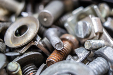 Metal hardware bolts and nails close-up. Macro photography
