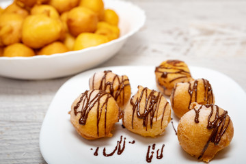 Small dessert donuts with chocolate frosting